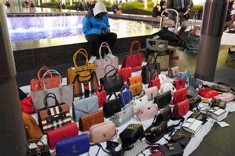 is it illegal to sell fake designer clothes|selling counterfeit designer bags.